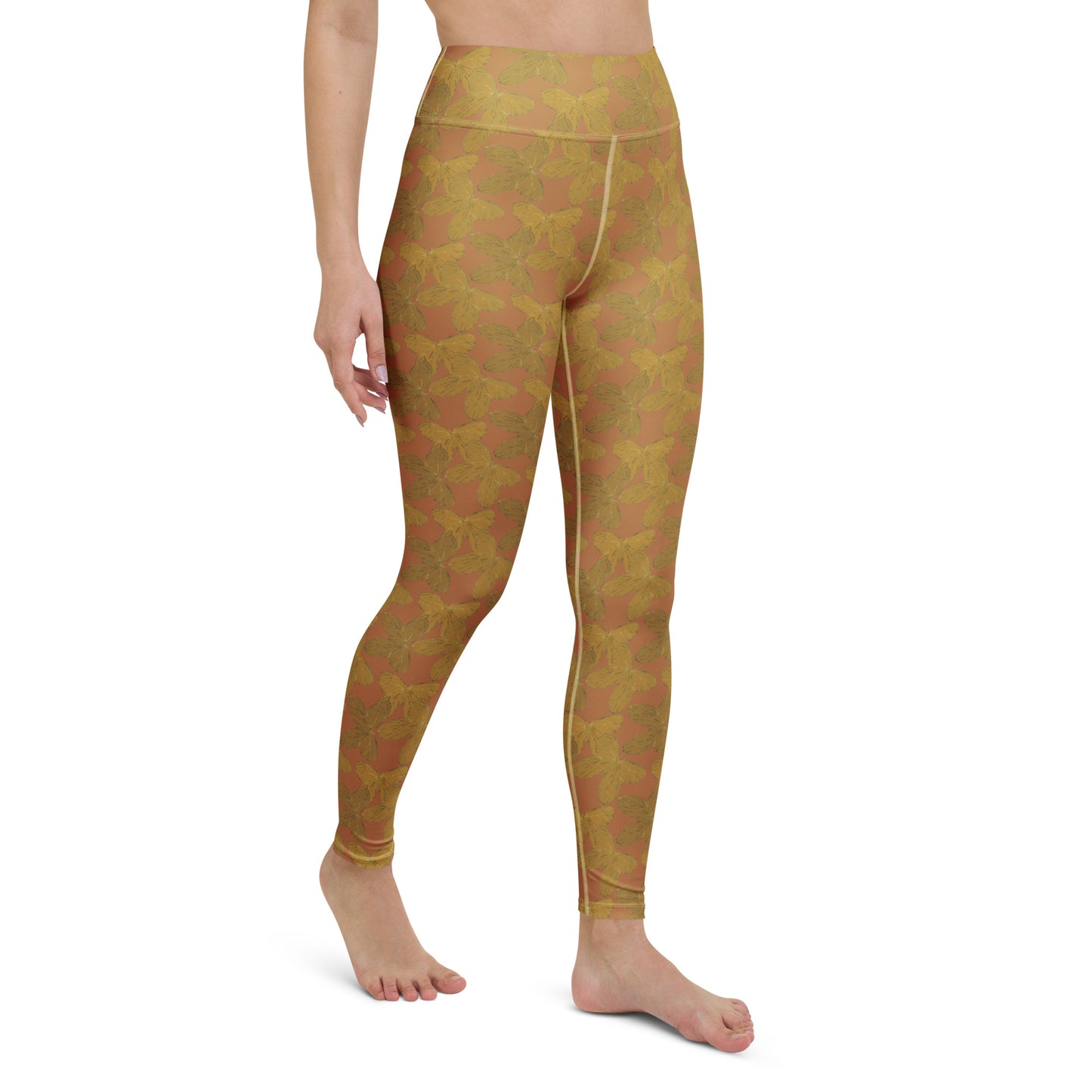 right front view of model wearing gold butterfly yoga leggings