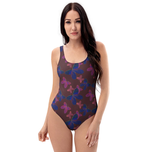 front view of model wearing butterfly one piece swimsuit in red