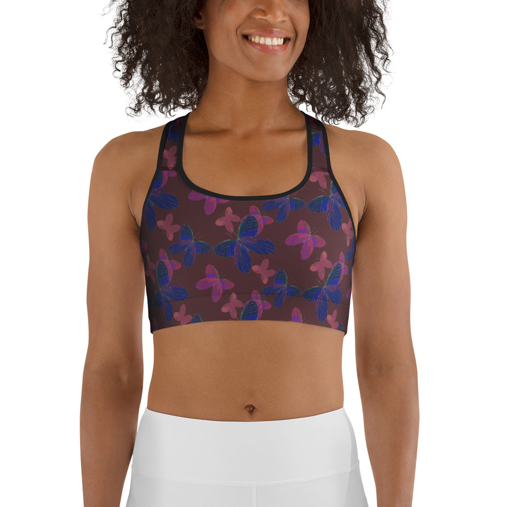  front view of model wearing butterfly  sports bra in red