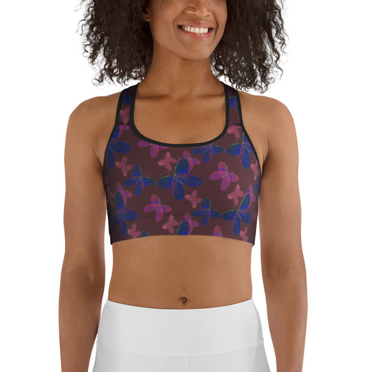  front view of model wearing butterfly  sports bra in red