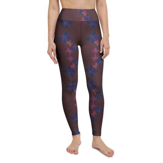 front view of model wearing butterfly yoga leggings in burgundy