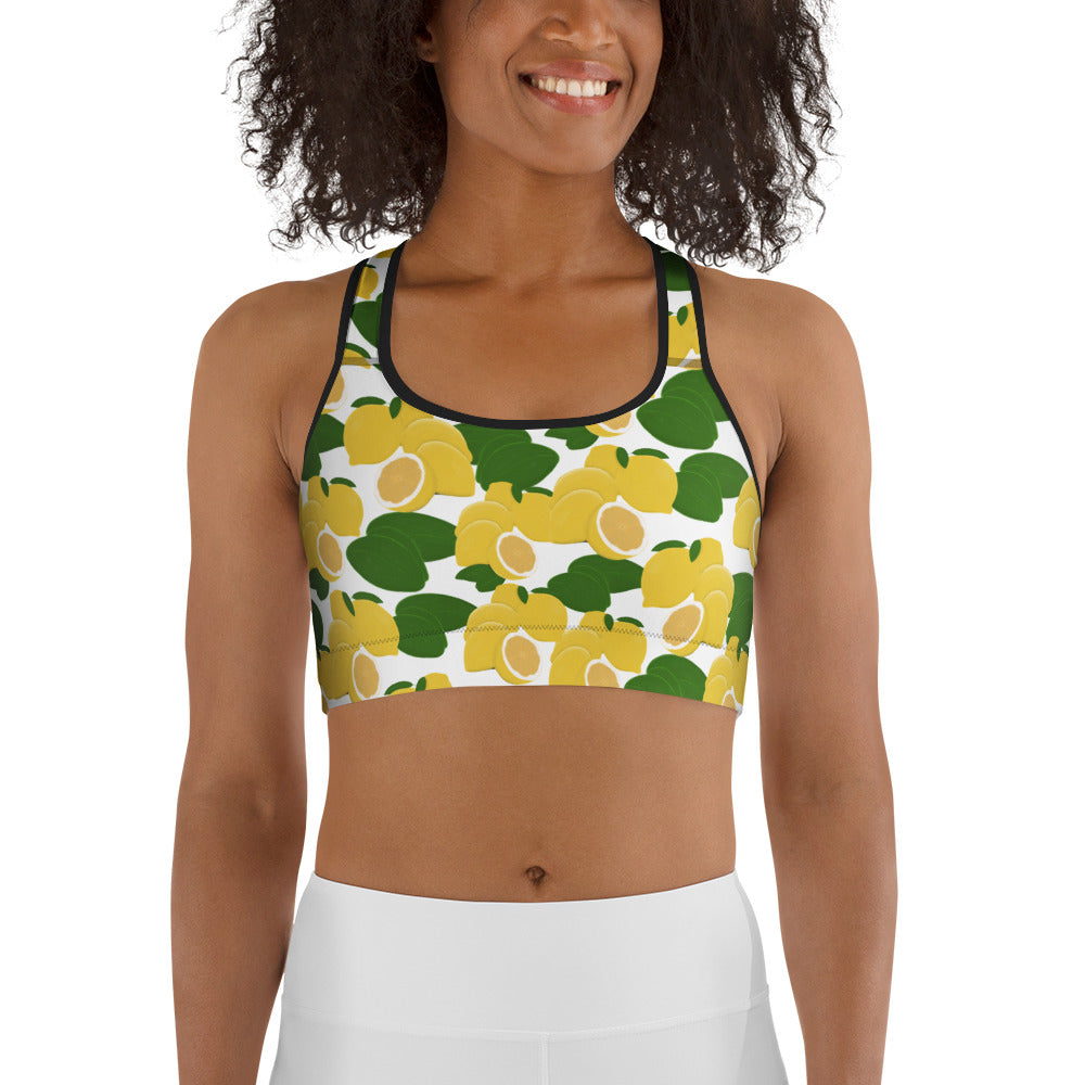  front view of model wearing citrus lemon sports bra in white with black trim
