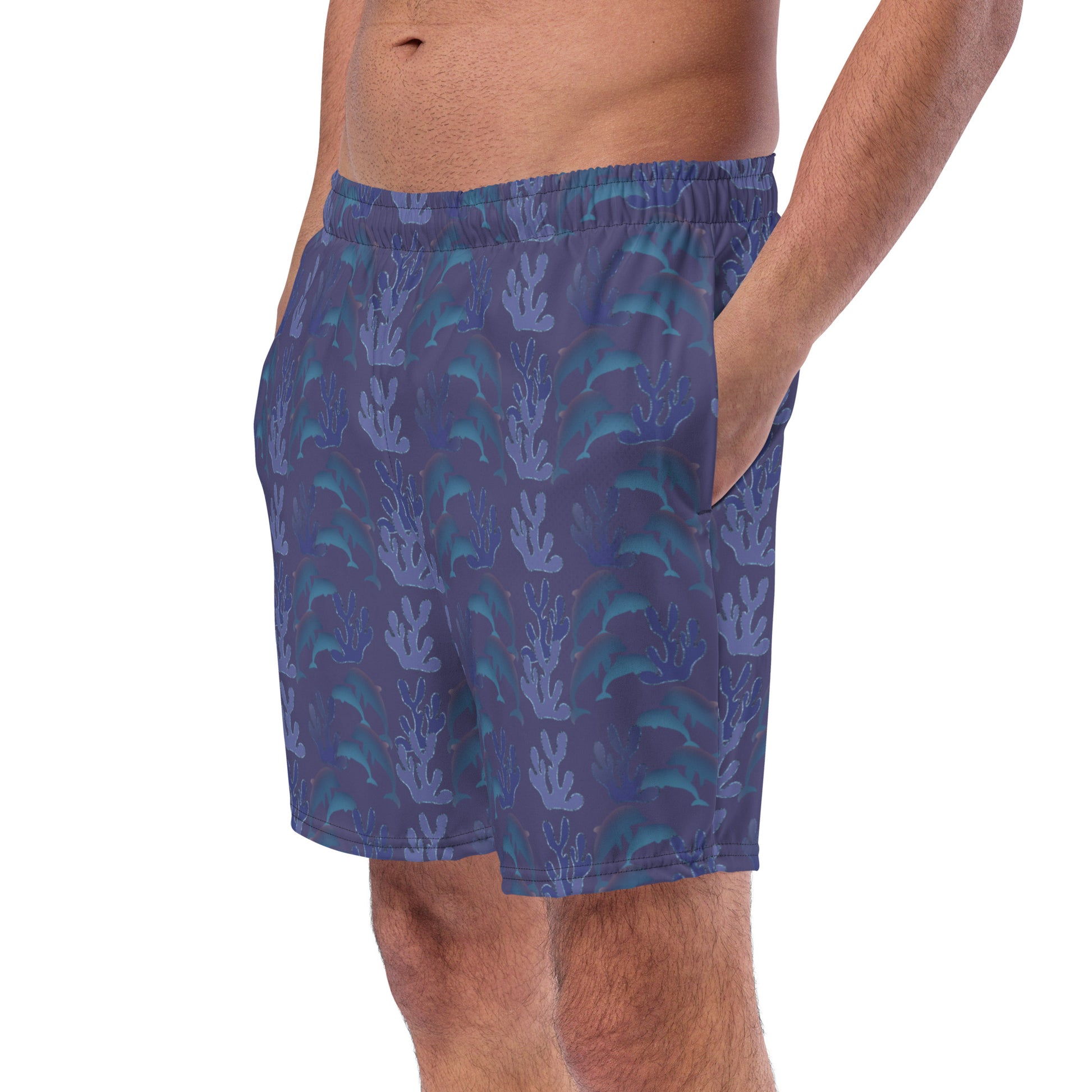 left front view of model wearing coral reef dolphins swim trunks in purple blue