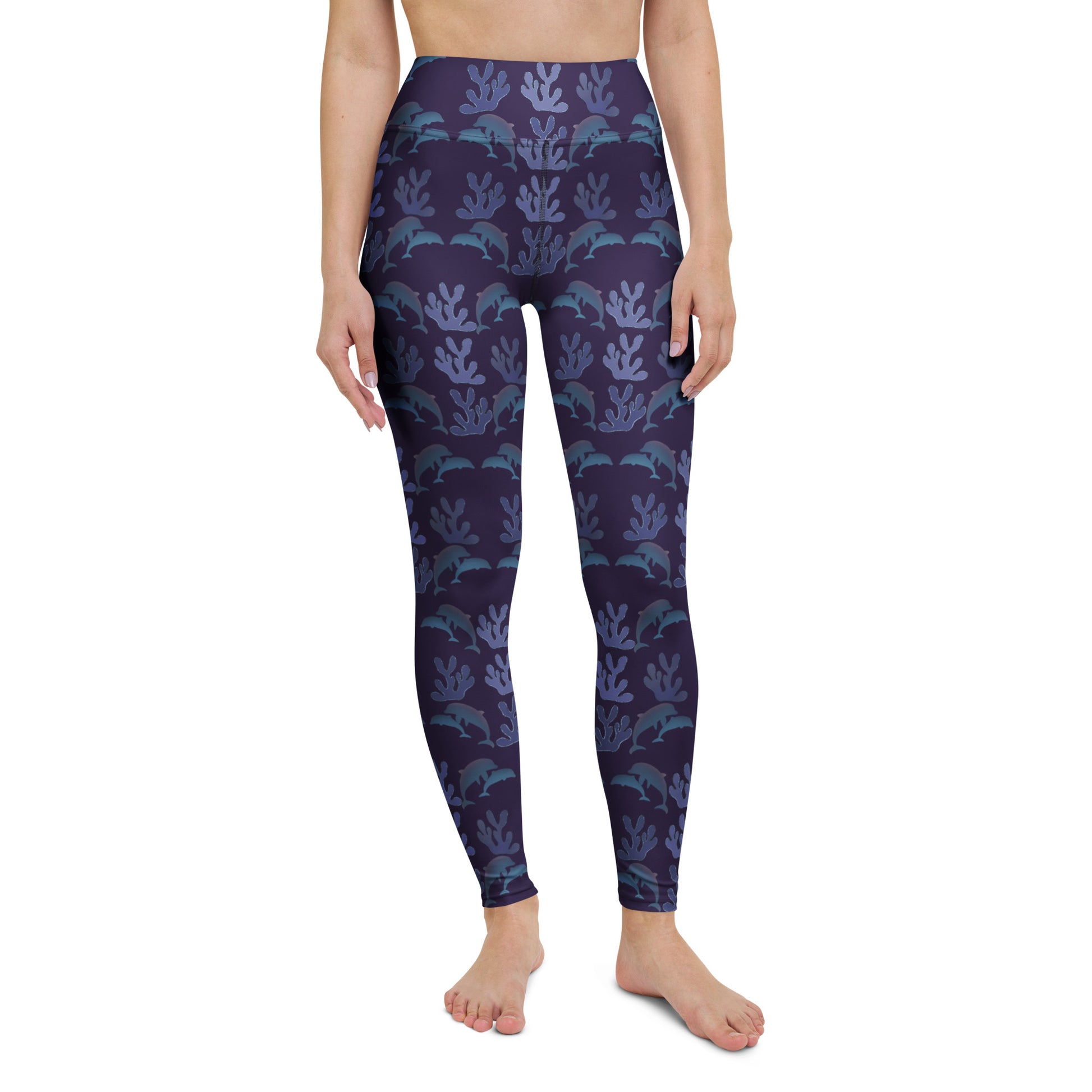  front view of model wearing coral reef dolphins yoga leggings