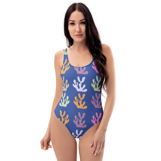 front view of model wearing coral reef one piece swimsuit in blue