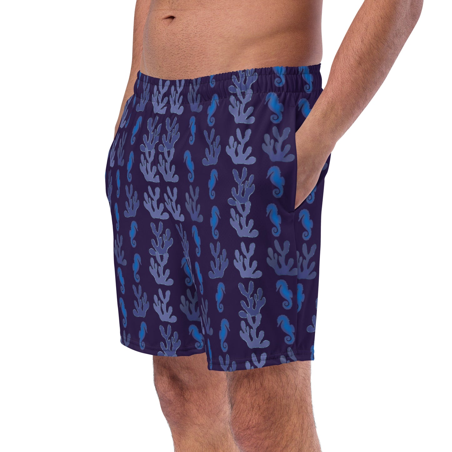left front view of model wearing coral reef seahorse swim trunks in purple
