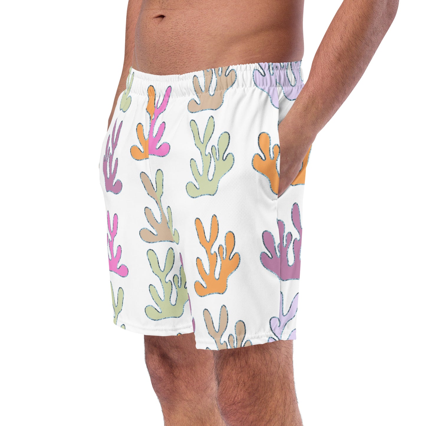 front view of model wearing coral reef swim trunks in white