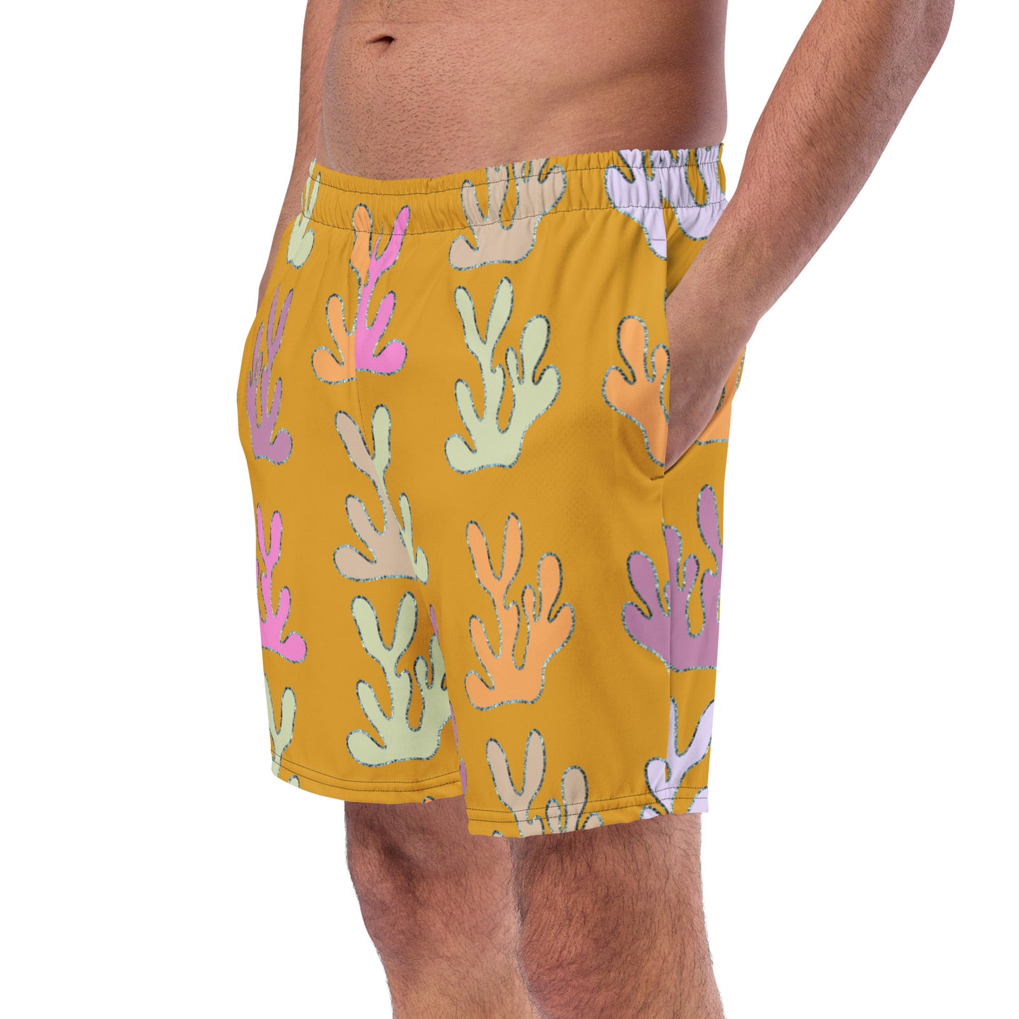 front view of model wearing coral reef swim trunks in yellow