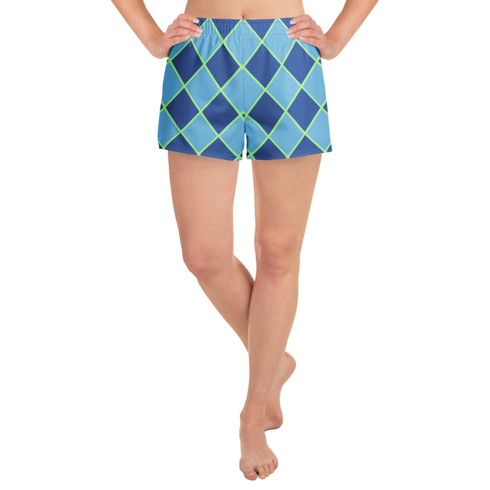 front view of model wearing diamond pattern swim shorts in blue