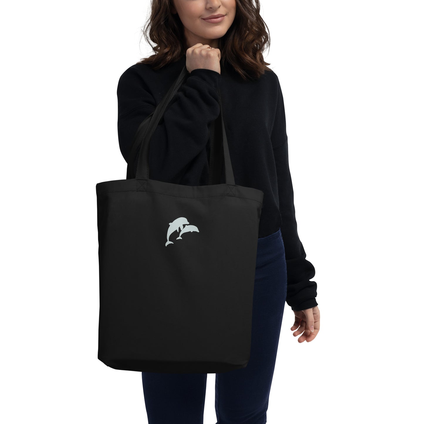 model carrying dolphins eco tote bag in black