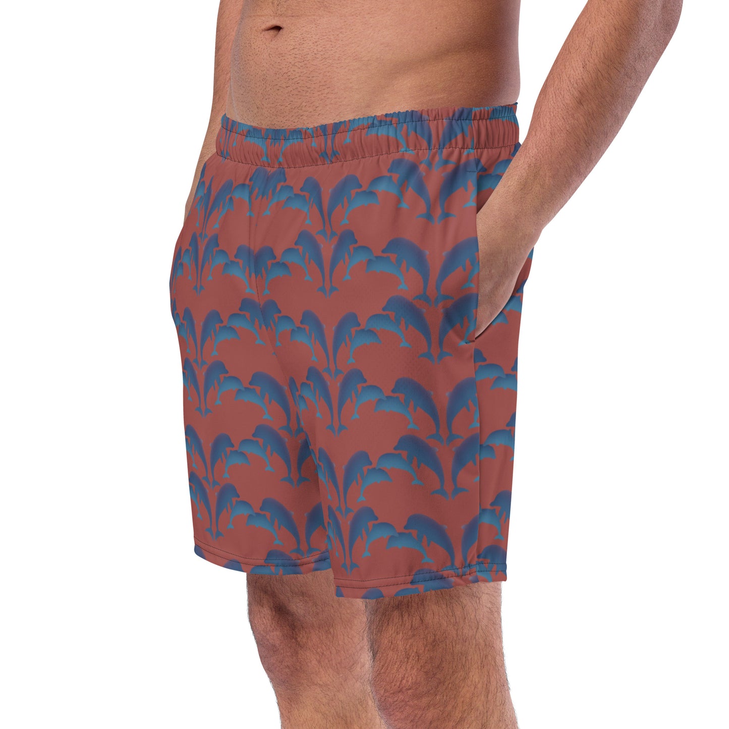 left front view of model wearing dolphins swim trunks in terracotta