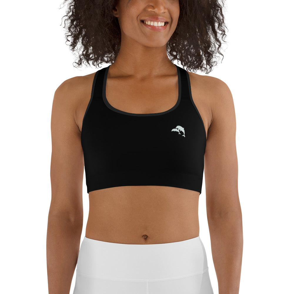  front view of model wearing dolphins wave cove logo sports bra in black