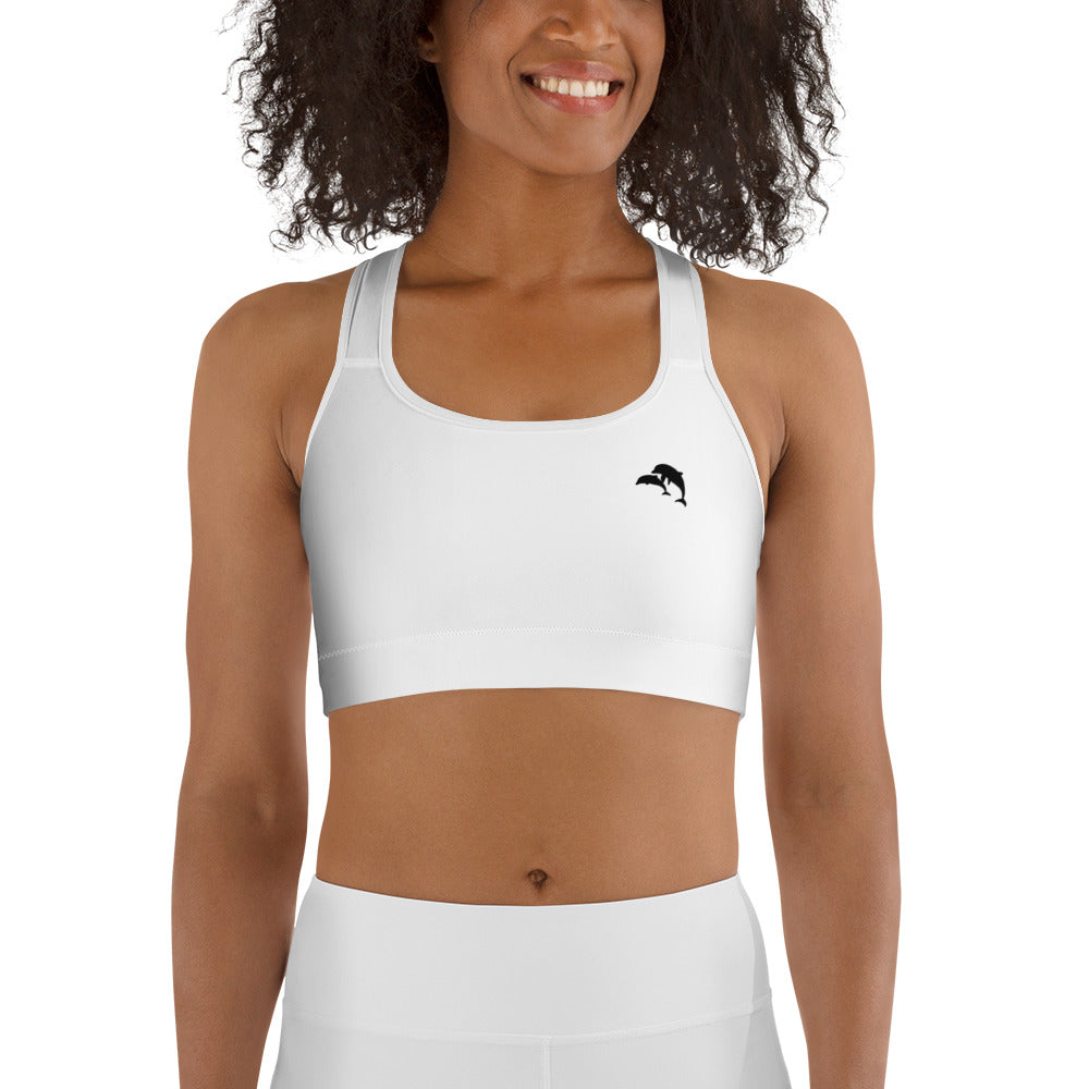  front view of model wearing dolphins wave cove logo sports bra in white