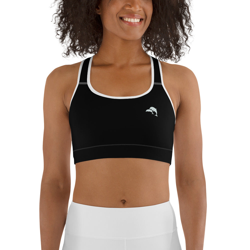  front view of model wearing dolphins wave cove logo sports bra in black