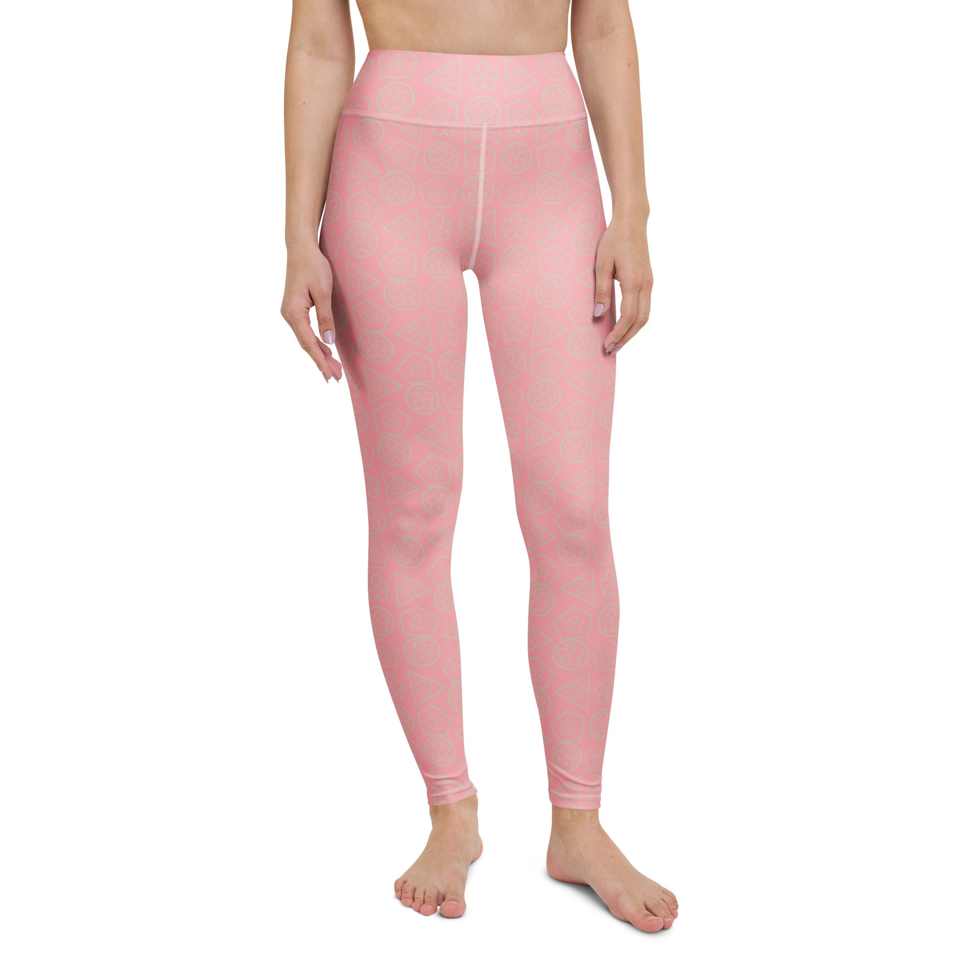 front view of model wearing floral geometric yoga leggings in pink