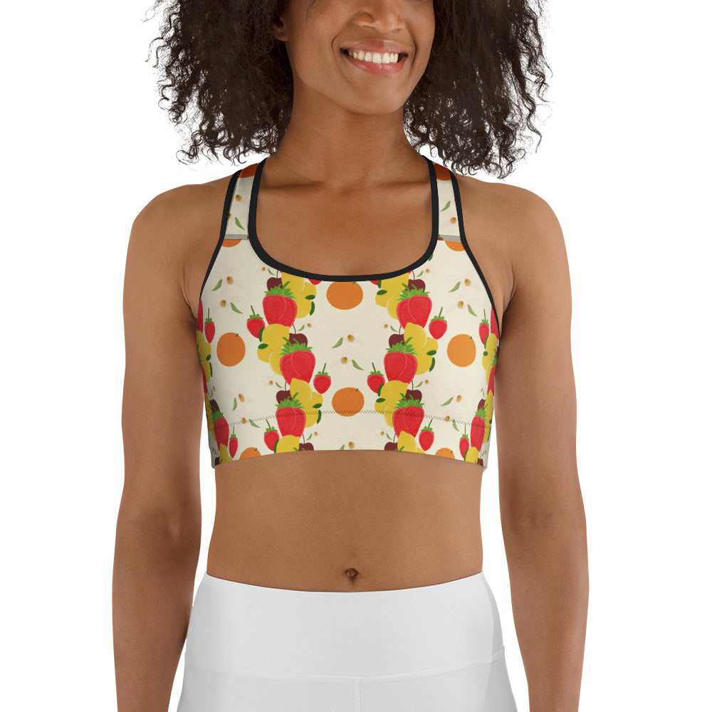 front view of model wearing light yellow fruit cocktail sports bra