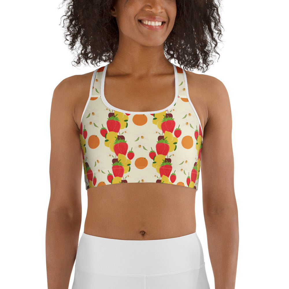 front view of model wearing light yellow fruit cocktail sports bra