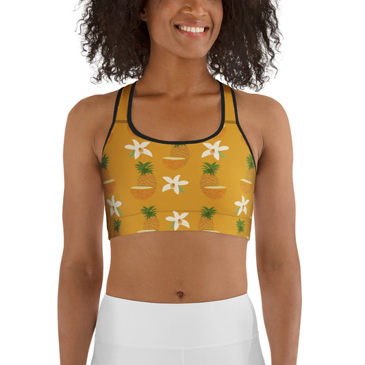  front view of model wearing pineapple sports bra in yellow with black trim