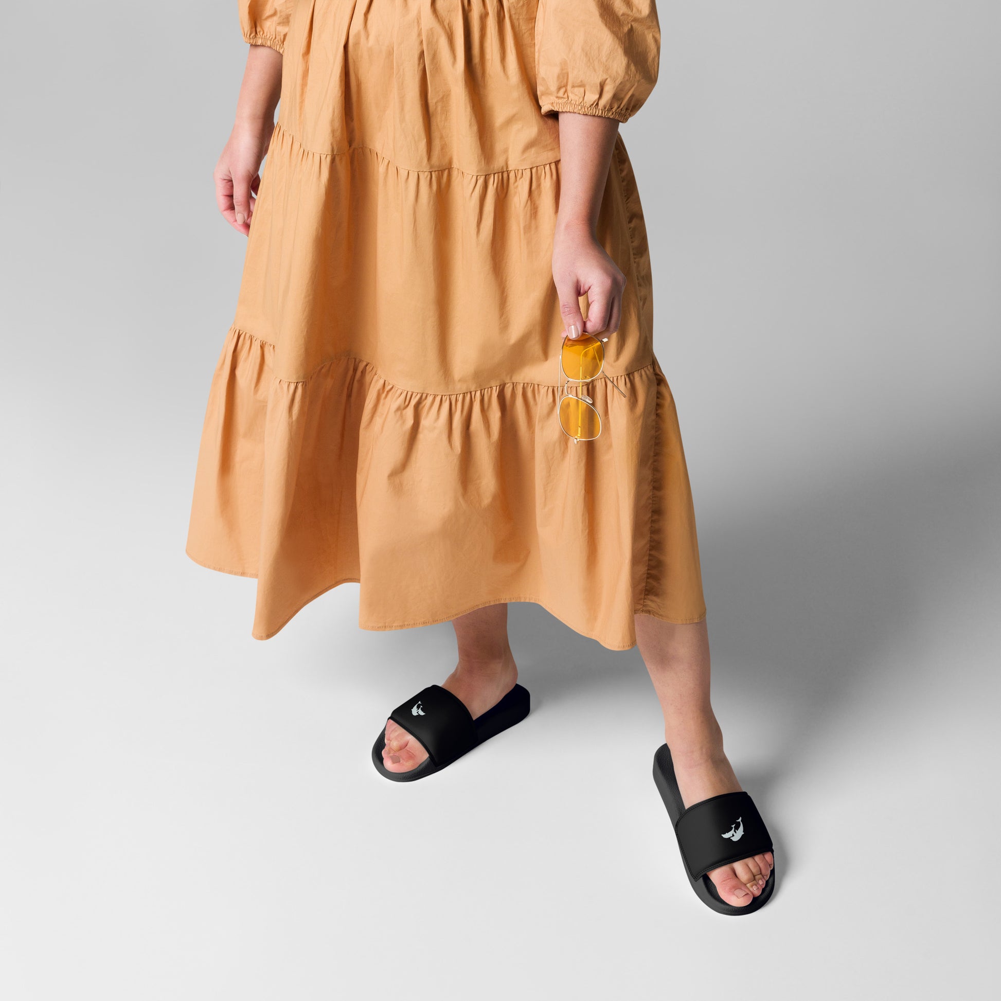front view of model wearing dolphins sandals