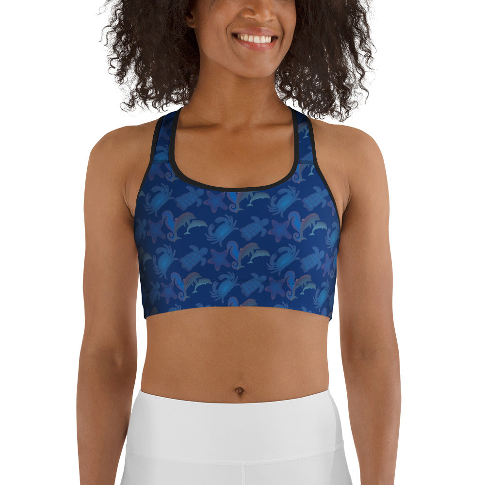  front view of model wearing seascape sports bra on navy