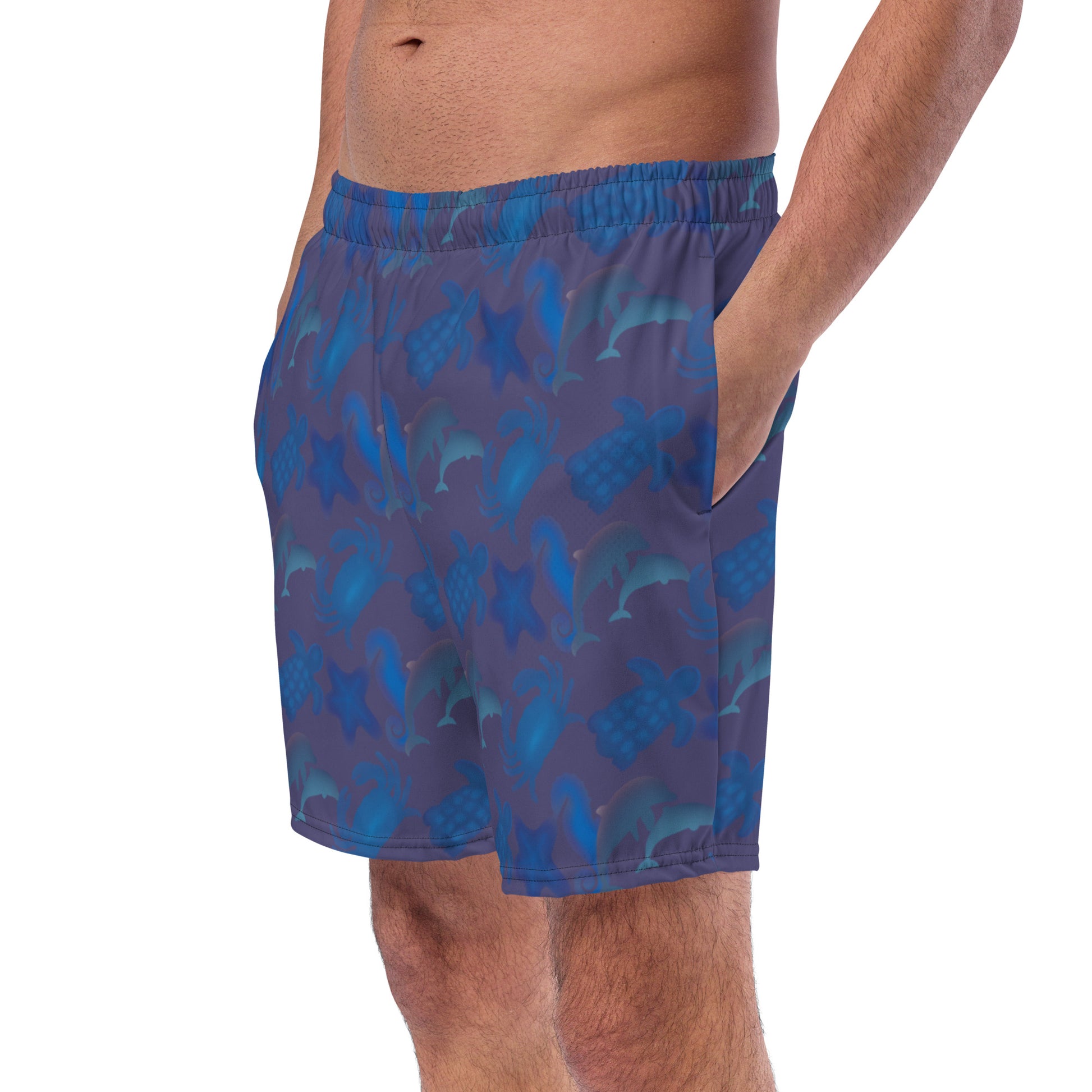 left front view of model wearing seascape swim trunks in blue