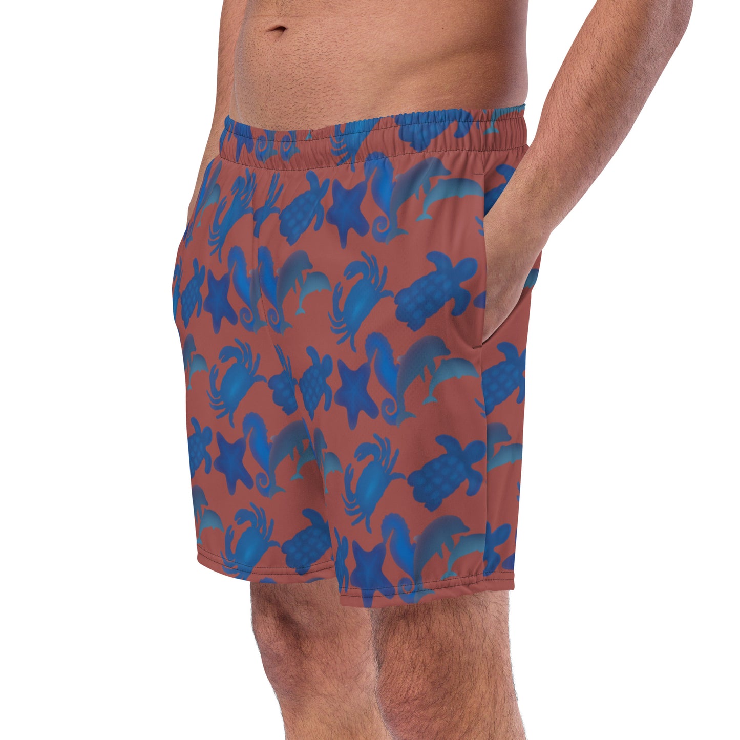 left front view of model wearing seascape swim trunks in terracotta