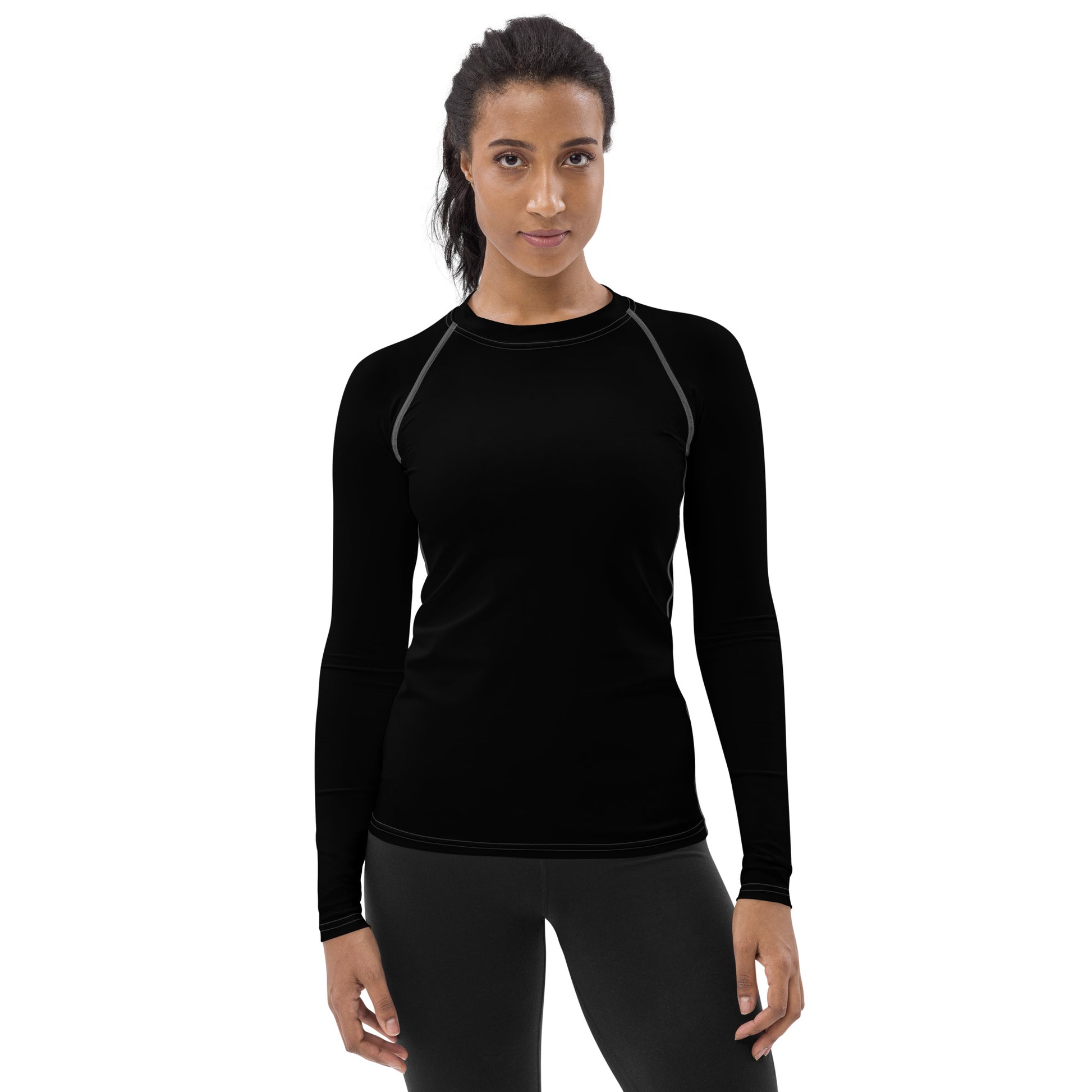 front view of model wearing rash guard in black